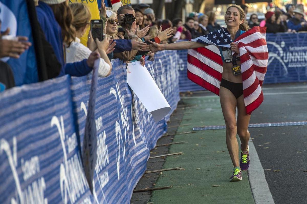 Sara Hall of Santa Rosa, Calif., takes a victory lap after winning the USATF Marathon Championships held in conjunction with the California International Marathon (CIM) in Sacramento, Calif., on Sunday, Dec. 3, 2017. Hall led the entire women’s race.