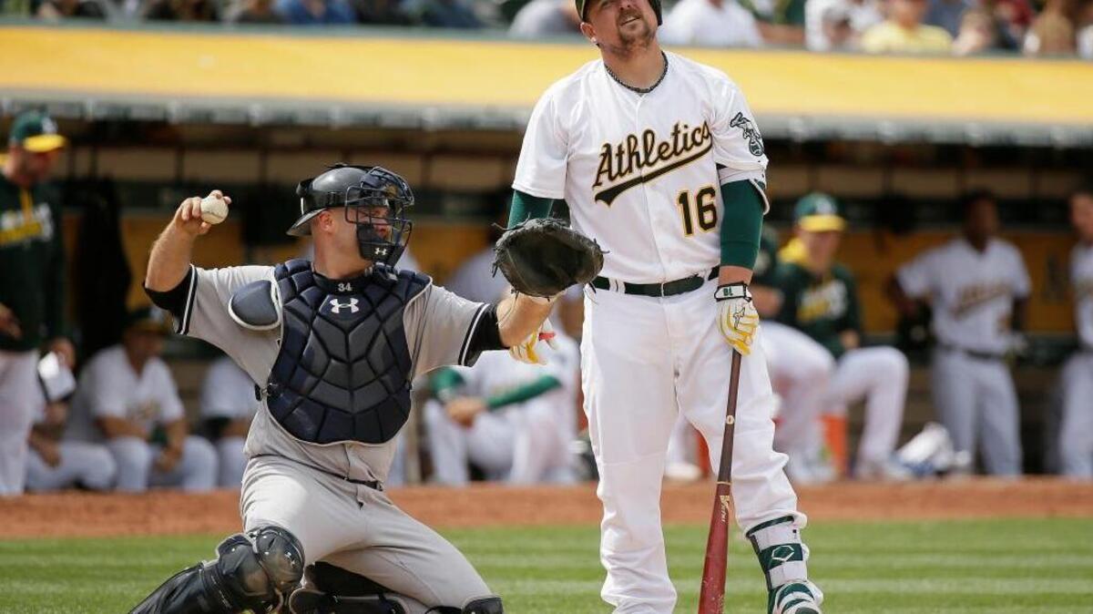 Oakland A’s pinch hitter Billy Butler reacts after a called strike as New York Yankees catcher Brian McCann returns the ball in the eighth inning of a baseball game Sunday, May 22, 2016, in Oakland, Calif. Butler wasn’t the only Athletics player frustrated in this series. The Yankees completed a four-game sweep Sunday.