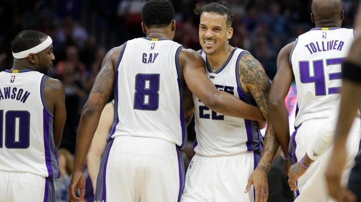 Sacramento Kings forward Rudy Gay (8) receives congratulations from Matt Barnes after scoring at the buzzer at the end of the third quarter in an NBA basketball game against the Minnesota Timberwolves in Sacramento, Calif., on Saturday, Oct. 29, 2016.