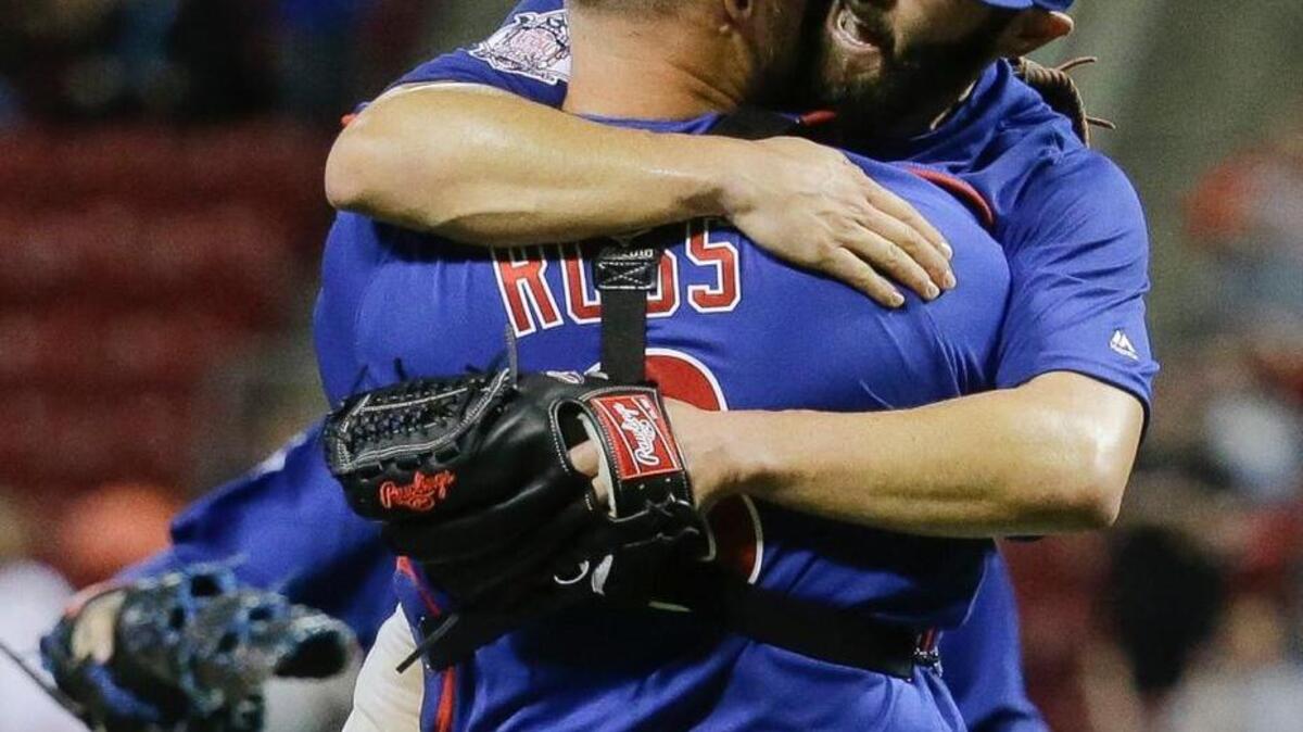 Chicago Cubs starting pitcher Jake Arrieta, right, celebrates with catcher David Ross after the final out of his no-hitter against the Cincinnati Reds, Thursday, April 21, 2016, in Cincinnati. The Cubs won 16-0.