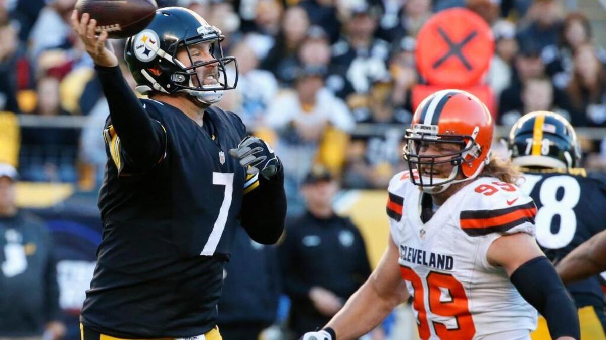 Pittsburgh Steelers quarterback Ben Roethlisberger (7) passes as Cleveland Browns outside linebacker Paul Kruger (99) pressures in the fourth quarter of an NFL football game, Sunday, Nov. 15, 2015, in Pittsburgh.