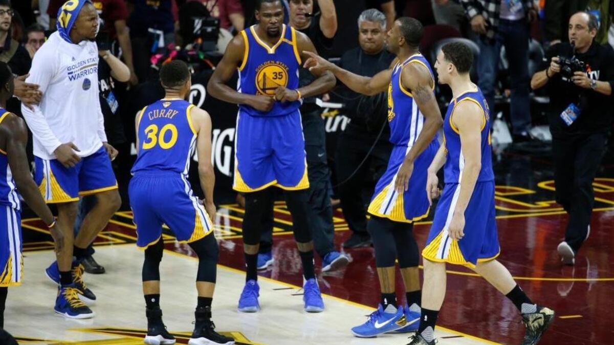 Kevin Durant and his Golden State Warriors teammates celebrate their win over the Cleveland Cavaliers on Wednesday in Game 3 of the NBA Finals.