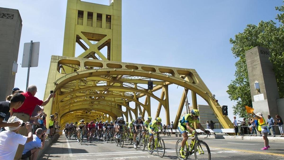 Riders pass through the Tower Bridge as they head for the Capitol on day one of the AMGEN Tour of California, which ended at the state Capitol on Sunday, May 10, 2015 in Sacramento, Calif.