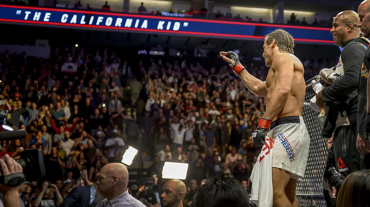 Fans cheer Urijah Faber from Sacramento after his victory over Brad Pickett from East London, England in their UFC bout at the Golden 1 Center, Saturday, Dec. 17, 2016.