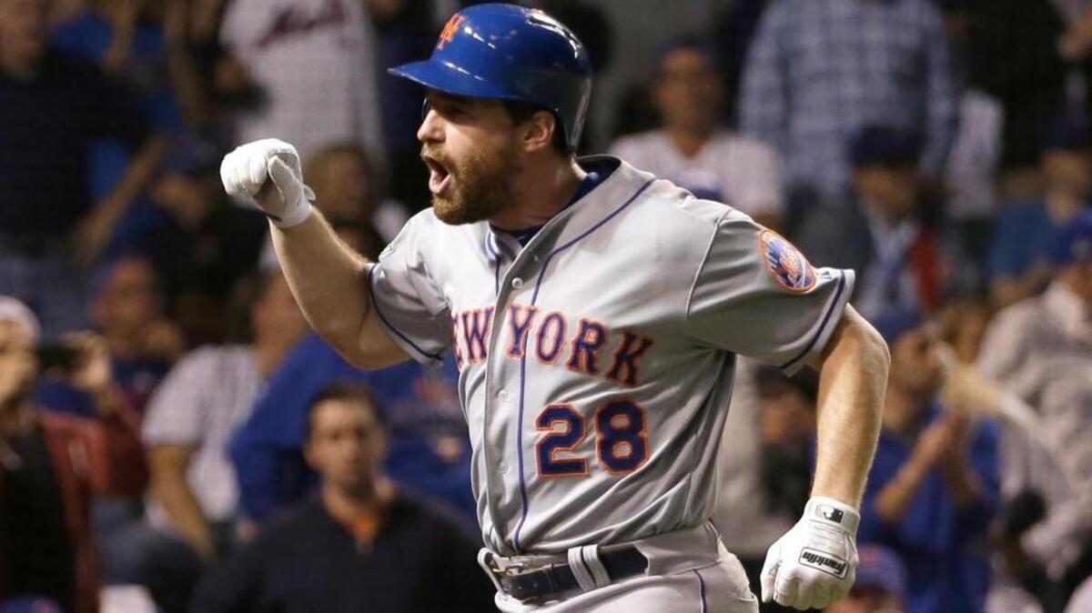 Daniel Murphy of the Mets has homered in six consecutive postseason games. The streak is the longest in major-league history. Here he celebrates after hitting a two-run home run in the eighth inning of Game 4 of the National League Championship Series against the Chicago Cubs, Wednesday, Oct. 21, 2015, in Chicago.