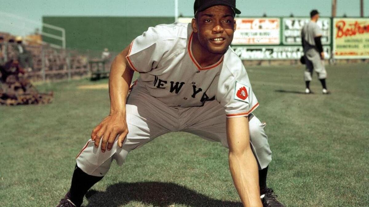 In this 1952, file photo, New York Giants infielder Monte Irvin poses during spring training. Irvin, a Hall of Fame power-hitting outfielder who starred for the team in the 1950s in a career abbreviated by major league baseball's exclusion of black players, died Monday night, Jan. 11, 2016, of natural causes at his Houston home. He was 96.
