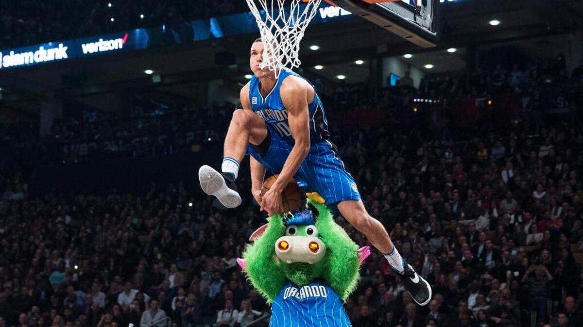 Orlando Magic forward Aaron Gordon slam with the help of team mascot Stuff during the NBA All-Star Slam Dunk Competition on Saturday, Feb. 13, 2016 in Toronto. Zach LaVine defeated Gordon to repeat as champion.
