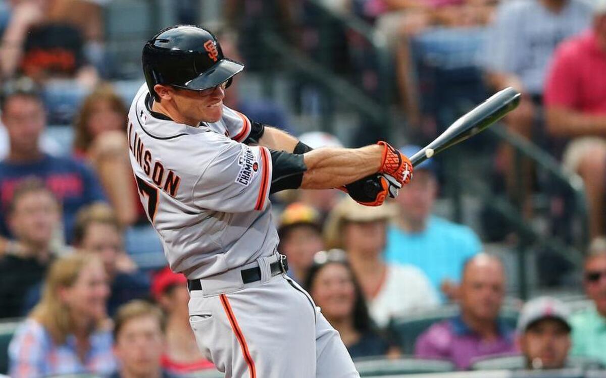 
Giants second baseman Kelby Tomlinson drives in a run with a base hit in the fourth inning against the Atlanta Braves, Wednesday, Aug. 5, 2015, in Atlanta. It was his first start for the Giants and he went 2 for 4. He singled and scored as a pinch-hitter two days earlier in his first major league at-bat.
