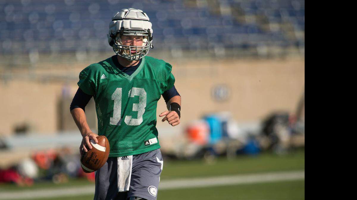 
Aggies quarterback Ben Scott works out during a practice at UC Davis in April.
