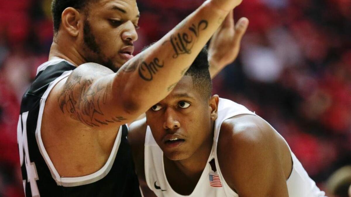 San Diego State forward Malik Pope, right, is guarded by Grand Canyon State forward Keonta Vernon on Friday, Dec. 18, 2015, in San Diego. Pope is a Laguna Creek High graduate.