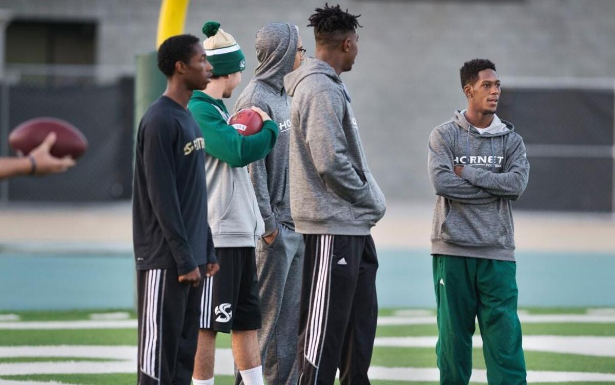 Sacramento State wide receiver Isiah Hennie, standing with teammates at practice Thursday, overcomes his small size with toughness, guile and determination.