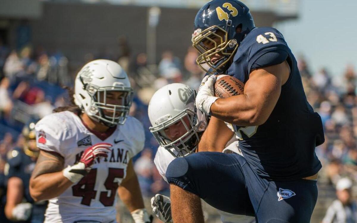 Derek Baljeu breaks into the end zone for a second-quarter touchdown that gave the Aggies a 13-7 lead. Montana then scored 20 unanswered points.