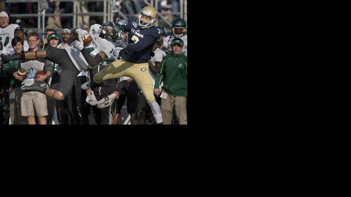 
Sac State’s Anthony Payne (24) intercepts a pass intended for UC Davis wide receiver TJ King.
