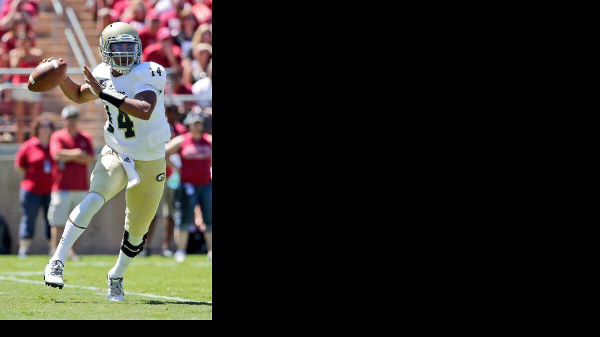 
UC Davis quarterback London Lacy throws against Stanford during the first half Aug. 30.
