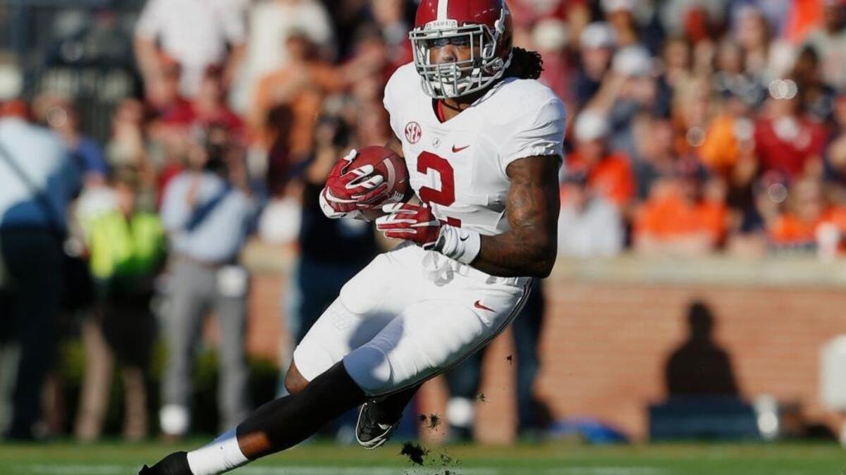 Alabama running back Derrick Henry runs against Auburn on Saturday, Nov. 28, 2015, in Auburn, Ala. Henry won the Heisman Trophy and highlights The Associated Press All-America team.