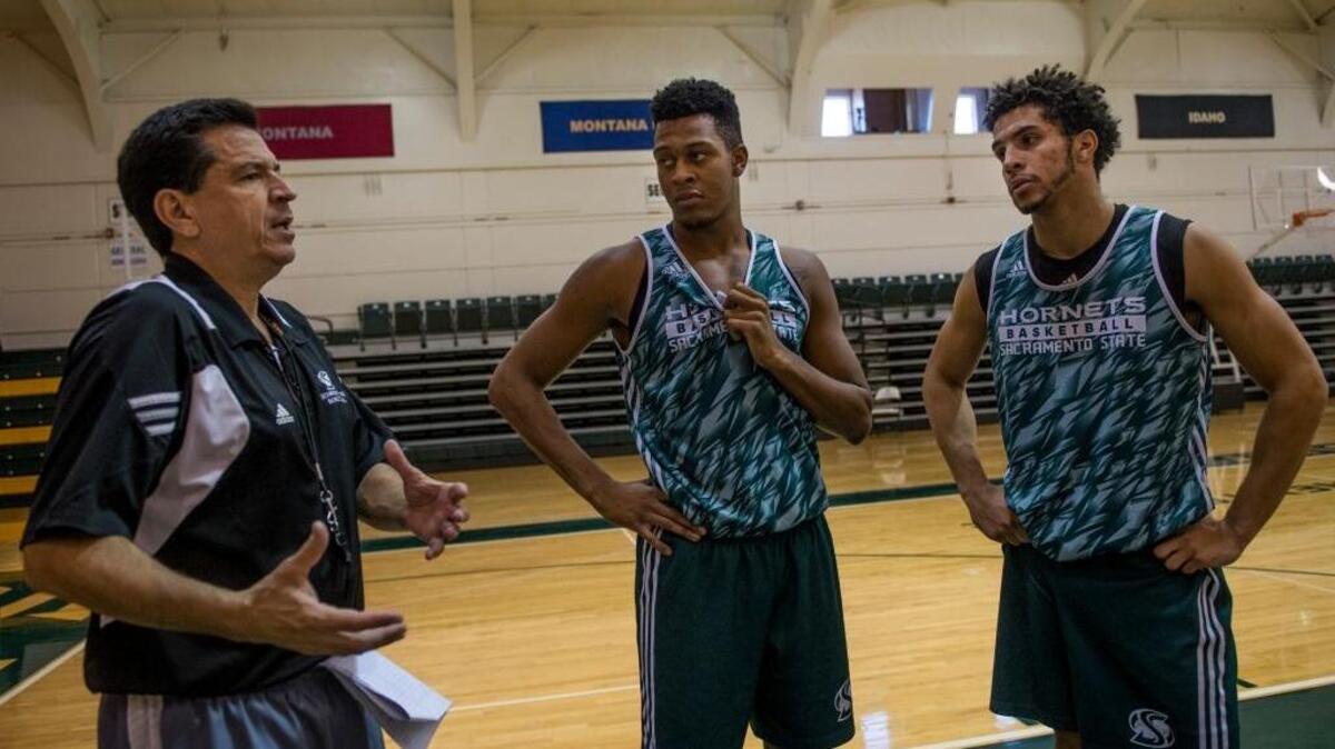 Sacramento State captains Nick Hornsby, middle, and Cody Demps speak with head basketball coach Brian Katz at practice on Thursday, Oct. 29, 2015, in Sacramento. All eyes will be on Demps and Hornsby this season as they take the leadership roles vacated by graduated stars Mikh McKinney and Dylan Garrity. That dynamic duo helped lead Sac State to a history making season last year.