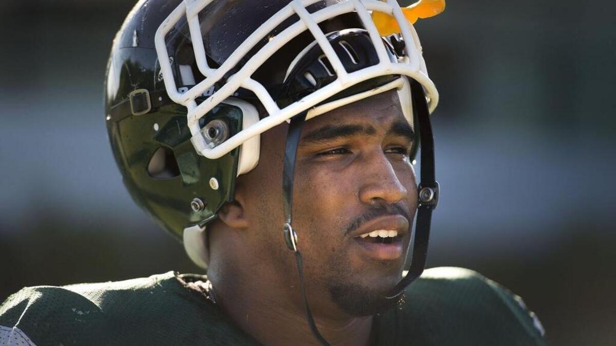 Linebacker Darnell Sankey takes a break on there sideline during practice at Sac State on Wednesday, August 26, 2015 in Sacramento.
