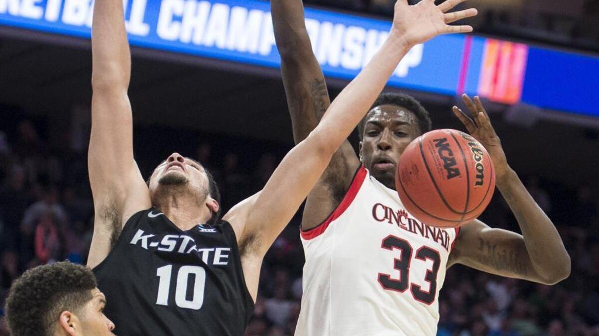 Cincinnati Bearcats center Nysier Brooks strips the ball away from Kansas State Wildcats forward Isaiah Maurice during the first half of a NCAA Division I first-round game Friday at Golden 1 Center.