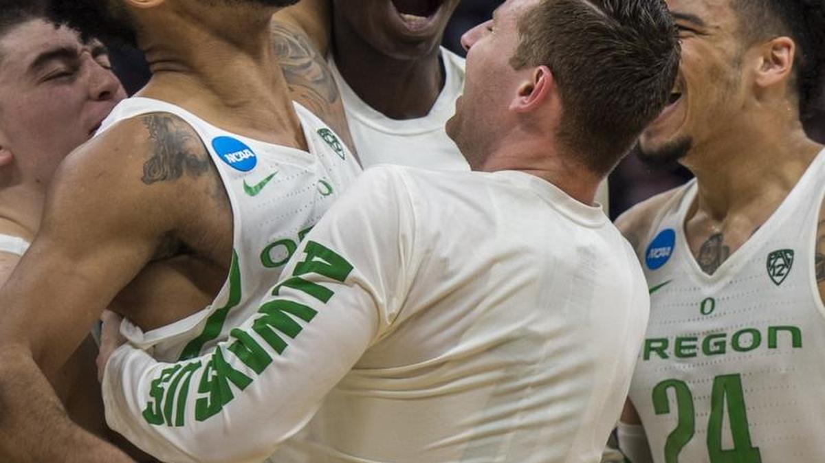 Oregon Ducks guard Tyler Dorsey (5) celebrates with his teammates after shooting the game winning three-point shot over Rhode Island Rams forward Kuran Iverson (23) late in the second half at the NCAA Tournament second-round game between the Oregon Ducks and Rhode Island Rams on Sunday at the Golden 1 Center in Sacramento.