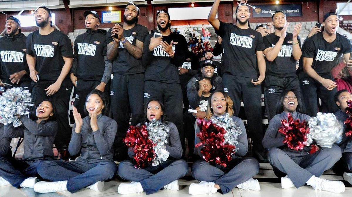 The North Carolina Central basketball team and cheerleaders react Sunday, March 12, 2017, in Durham, N.C., to the announcement that the Eagles will be playing UC Davis in Dayton, Ohio, in the NCAA Tournament.