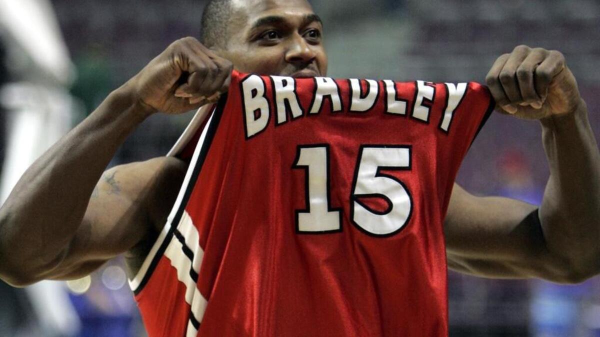 Marcellus Sommerville shows off his team’s jersey after leading Bradley to a upset of Kansas in the NCAA Tournament on March 17, 2006, in Auburn Hills, Mich. Sommerville scored 21 points to lead the 13th-seeded Braves to a 77-73 win over No. 4 Jayhawks in a first-round matchup.