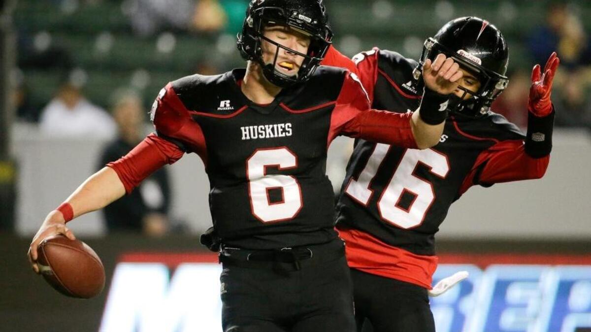 
Nate Ketteringham, left, celebrates with Devin Asiasi after scoring against De La Salle during the first half of the CIF Open Division high school football championship game in Carson, Dec. 20, 2014. Now a freshman at Sacramento State, Ketteringham will start for the Hornets Saturday at Southern Utah.
