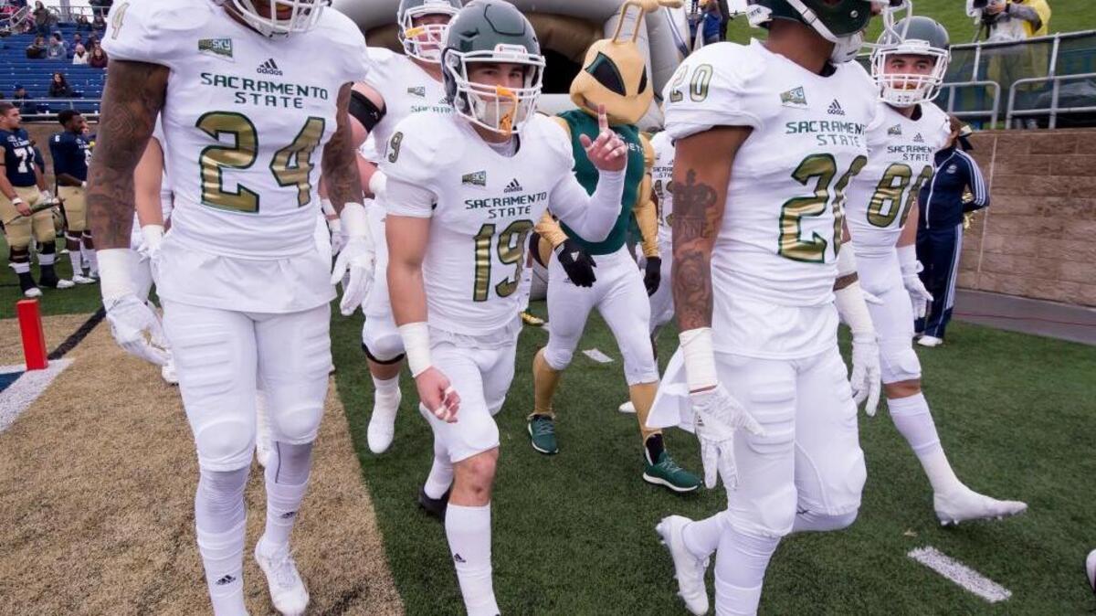 FILE -- The Sacramento State Hornets come onto the field before the game as the UC Davis Aggies host the Sacramento State Hornets in the Causeway Classic, Saturday Nov. 19, 2016. Sacramento State opened its home schedule with a rout of Incarnate Word of San Antonio.