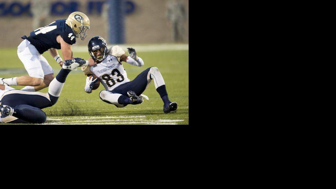 
UC Davis Aggies defensive back Zach Jones (44), tackles Northern Colorado Bear's wide receiver Sean Leslie (83), during the third quarter as the Davis Aggies host the Northern Colorado Bears football team, Saturday November 1, 2014.
