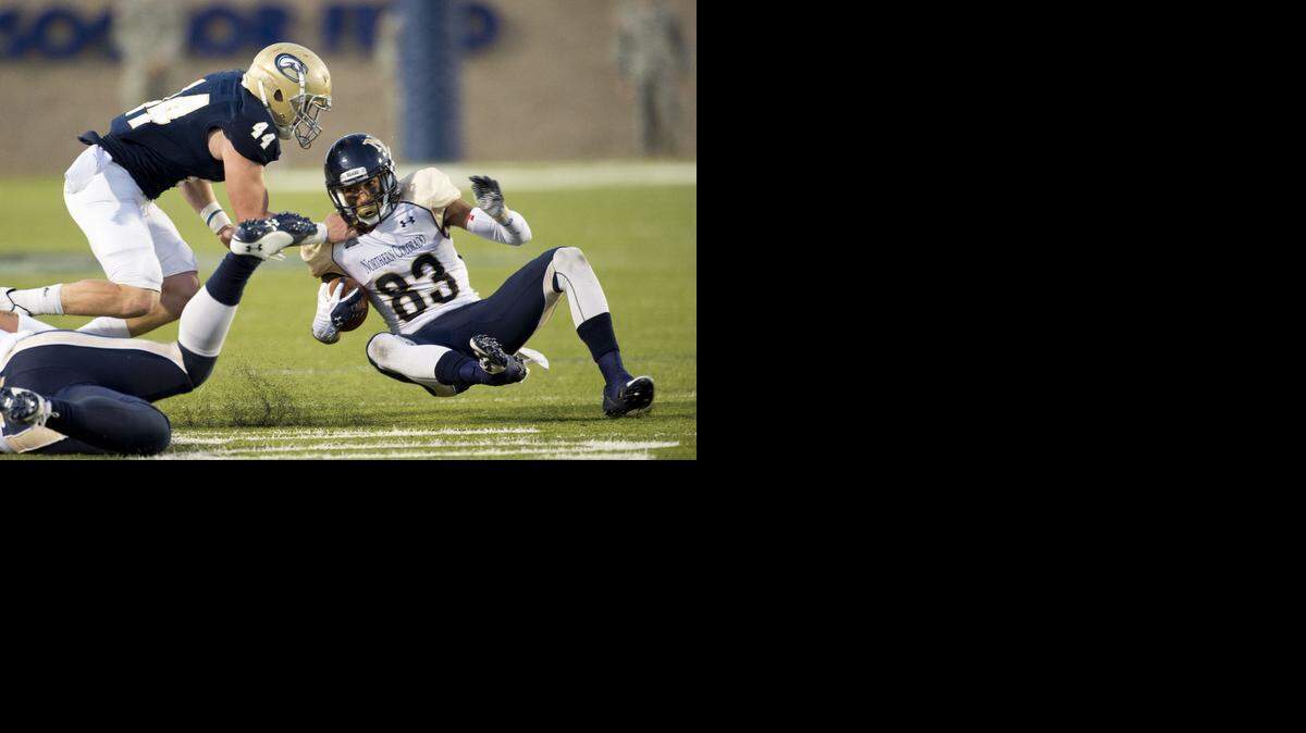 
UC Davis Aggies defensive back Zach Jones (44), tackles Northern Colorado Bear's wide receiver Sean Leslie (83), during the third quarter as the Davis Aggies host the Northern Colorado Bears football team, Saturday November 1, 2014.
