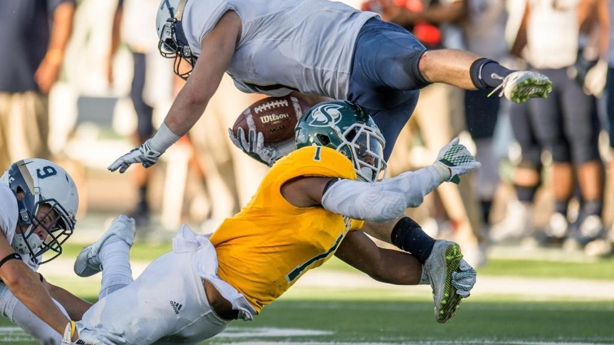 
Sacramento State defensive back Joey Banks (1) tackles Eastern Oregon wide receiver Jake Billingsley (7) during the first half on Sept. 5 in Sacramento. 
