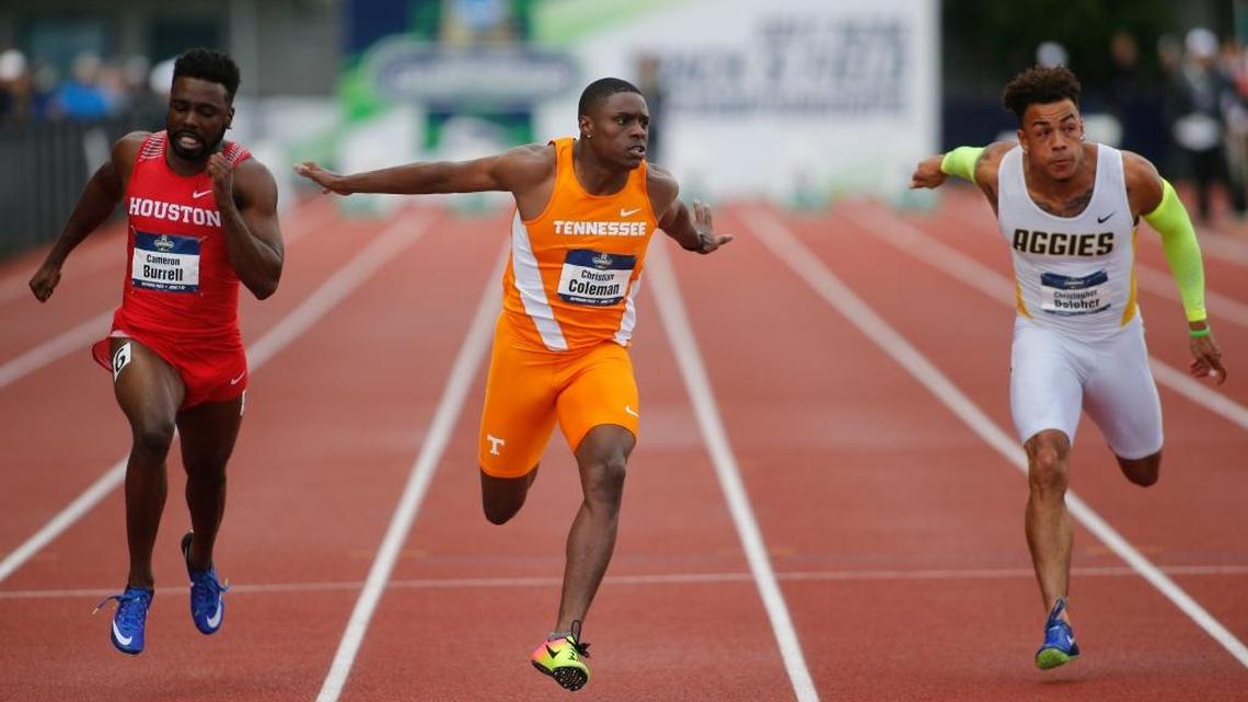 Tennessee’s Christian Coleman, center, beats Houston’s Cameron Burrell, left, and North Carolina A&T’s Christopher Belceher, right, to win the men’s 100 meters at the NCAA outdoor college track and field championships in Eugene, Ore., Friday. Coleman won in 10.04 seconds, Burrell finished second and Belcher third.