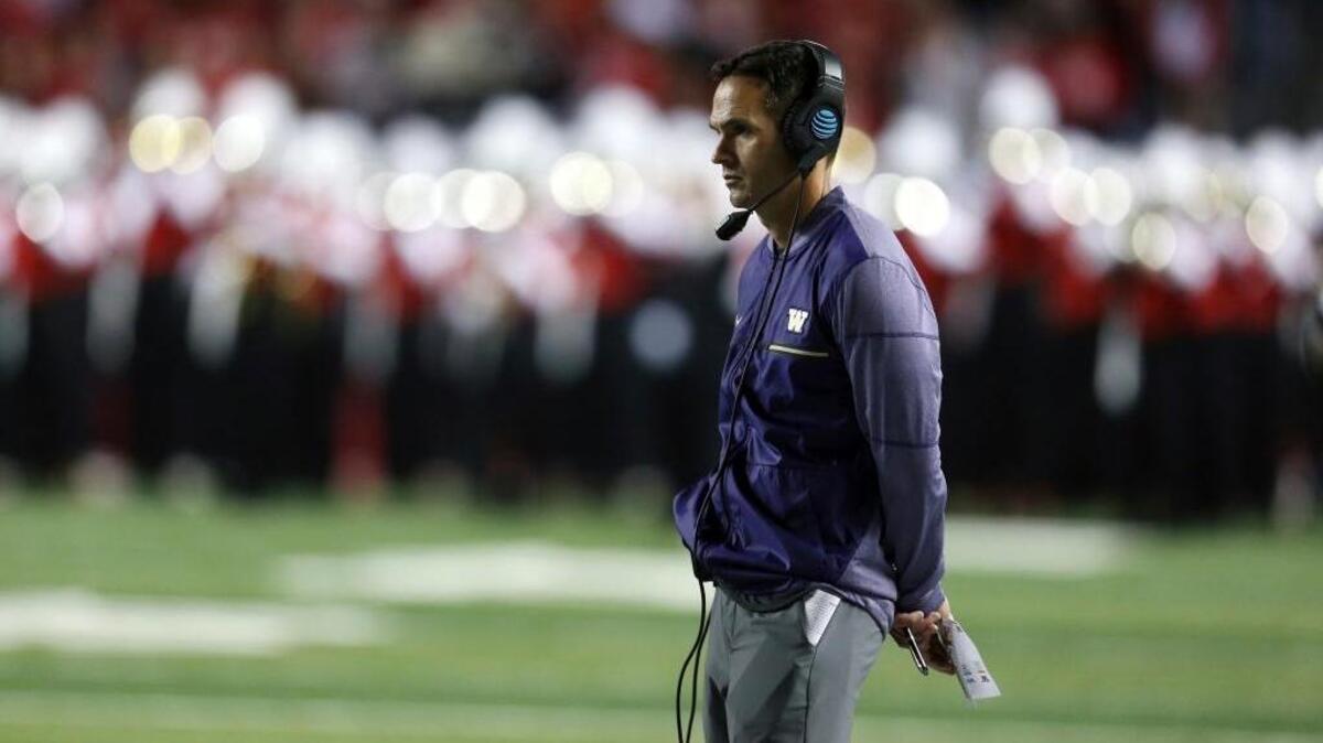 Washington coach Chris Petersen mans the sidelines during a game against Rutgers on Friday in Piscataway, N.J.