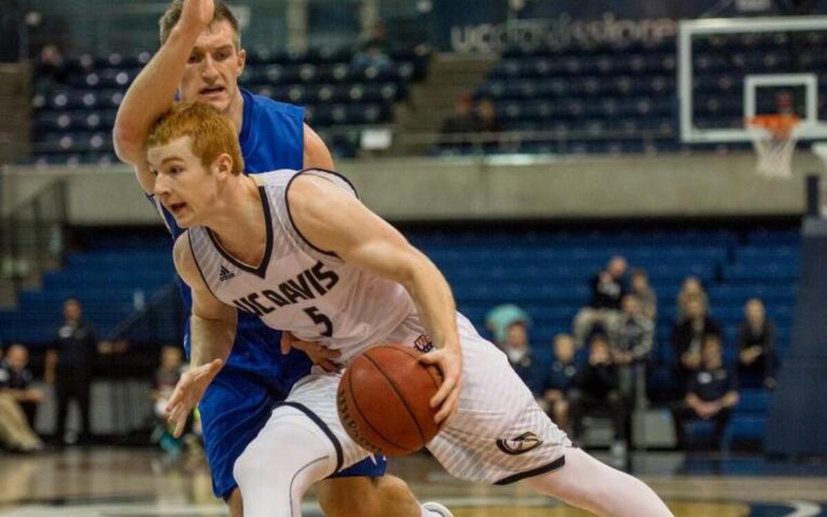 UC Davis Aggies guard Siler Schneider (5) drives to the basket during an NCAA college basketball game against the Air Force Academy on Saturday, Dec. 19, 2015, in Davis.