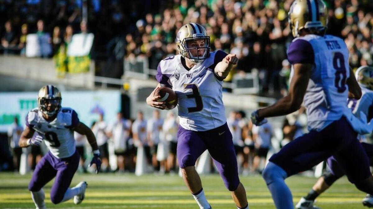 Washington quarterback Jake Browning (3) gives direction to a receiver against Oregon in an NCAA college football game Saturday, Oct. 8, 2016, in Eugene, Ore.