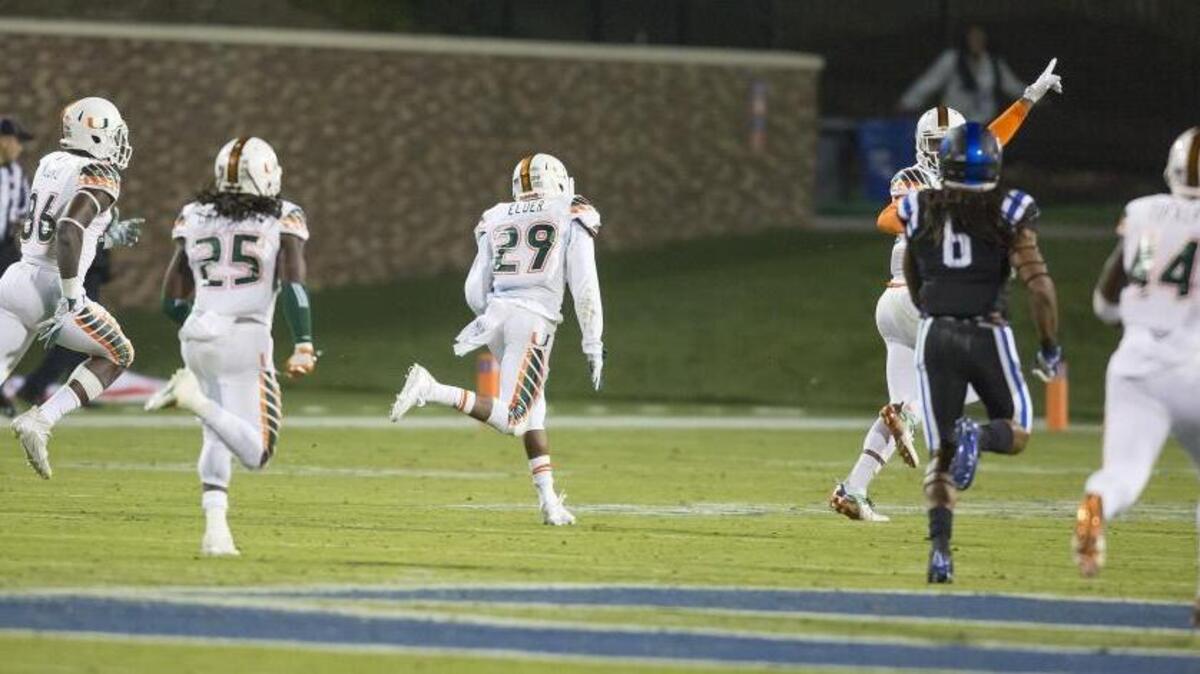 Miami’s Corn Elder (29) returns a kickoff, which featured multiple laterals before Elder subsequently received the final lateral, and scores to beat Duke 30-27 in Durham, N.C., Saturday, Oct. 31, 2015.