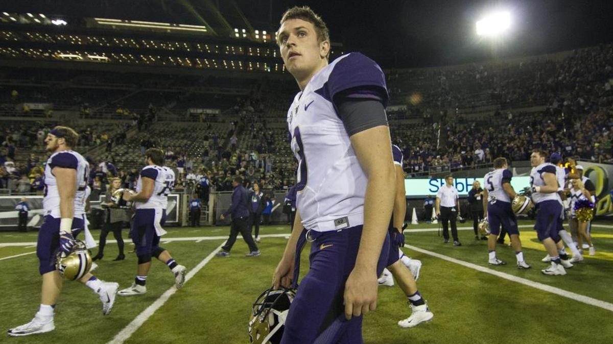 Washington quarterback Jake Browning (3) walks off the field following the game. The Washington Huskies played the Oregon Ducks in a football game at Autzen Stadium in Eugene, Ore., on Saturday, October 8, 2016.