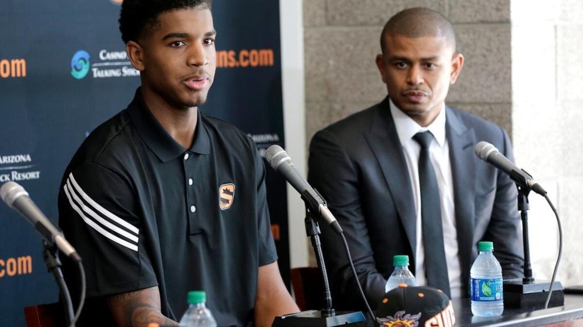 Phoenix Suns first-round draft pick Marquese Chriss, left, speaks as head coach Earl Watson listens Friday, June 24, 2016, in Phoenix. Chriss, a Sacramento-area native, averaged 10 points in three NBA Summer League games.