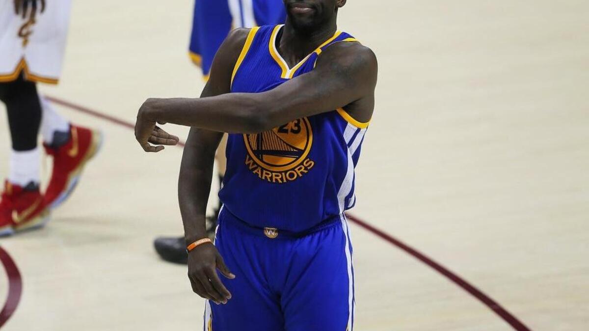The Golden State Warriors' Draymond Green reacts to a technical foul that was called back against the Cleveland Cavaliers in the third quarter during Game 4 of the NBA Finals at Quicken Loans Arena in Cleveland on Friday, June 9, 2017. The Cavs won, 137-116, trimming their series deficit to 3-1.