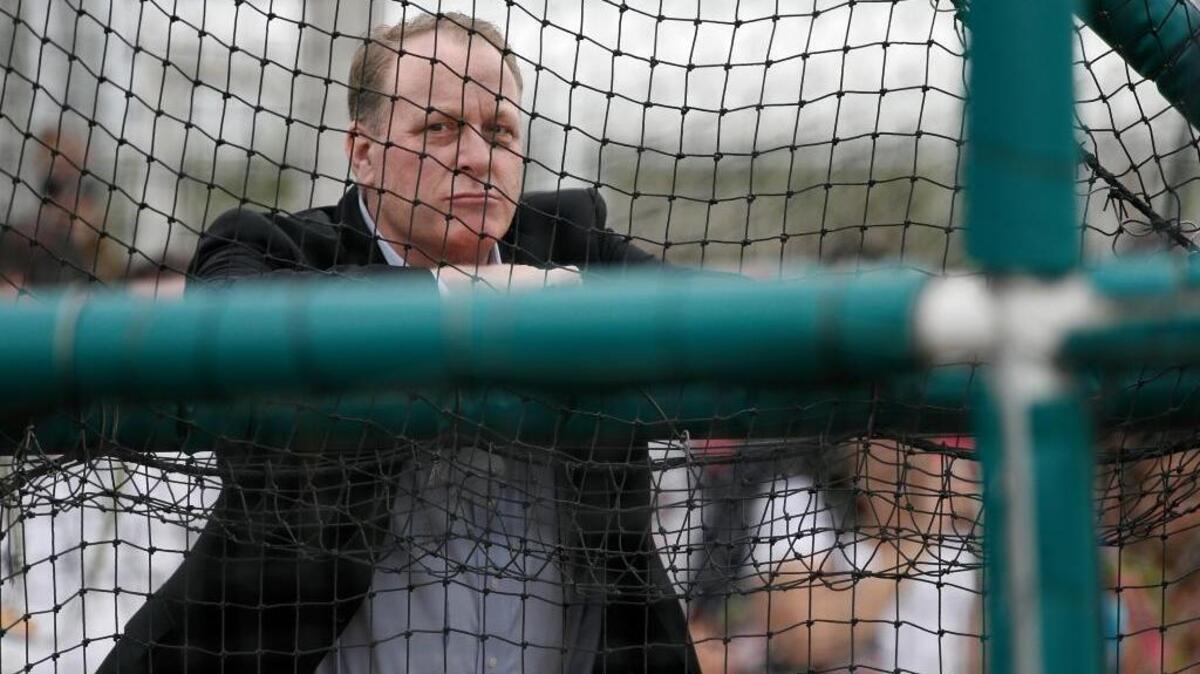 Curt Schilling watches as infielders take batting practice at baseball spring training in Fort Myers Fla., Wednesday Feb. 25, 2015 in Fort Myers, Fla. At the time, he still had a job with ESPN. The network fired him after his reposting of a meme widely interpreted as anti-transgender on his Facebook page.