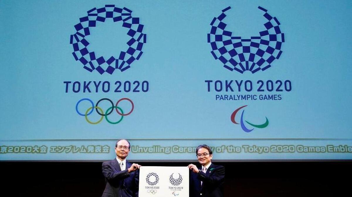 In this April 25, 2016, file photo, Tokyo 2020 Emblems Selection Committee Chairperson Ryohei Miyata, right, and its member and Japanese baseball great Sadaharu Oh hold new official logos of the 2020 Tokyo Olympics, left, and the 2020 Tokyo Paralympic Games during the unveiling ceremony in Tokyo. On Friday, the International Olympic Committee announced 15 new events for the 2020 Tokyo Olympics.