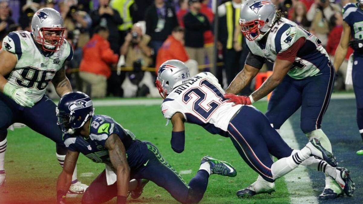 New England Patriots strong safety Malcolm Butler (21) intercepts a pass during the waning moments of Super Bowl XLIX football game against the Seattle Seahawks Sunday, Feb. 1, 2015, in Glendale, Ariz.