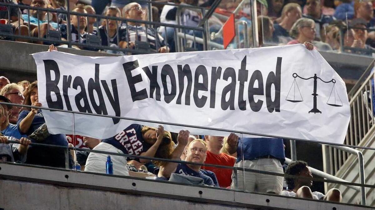 
NFL Commissioner Roger Goodell has not had much luck with getting his suspension of players to stick. Patriots fans hold a sign that refers to quarterback Tom Brady in the first half of an NFL preseason football game between the Patriots and the New York Giants on Thursday, Sept. 3, 2015, in Foxborough, Mass. Federal Judge Richard M. Berman overturned Goodell’s four-game suspension of Brady that morning. 
