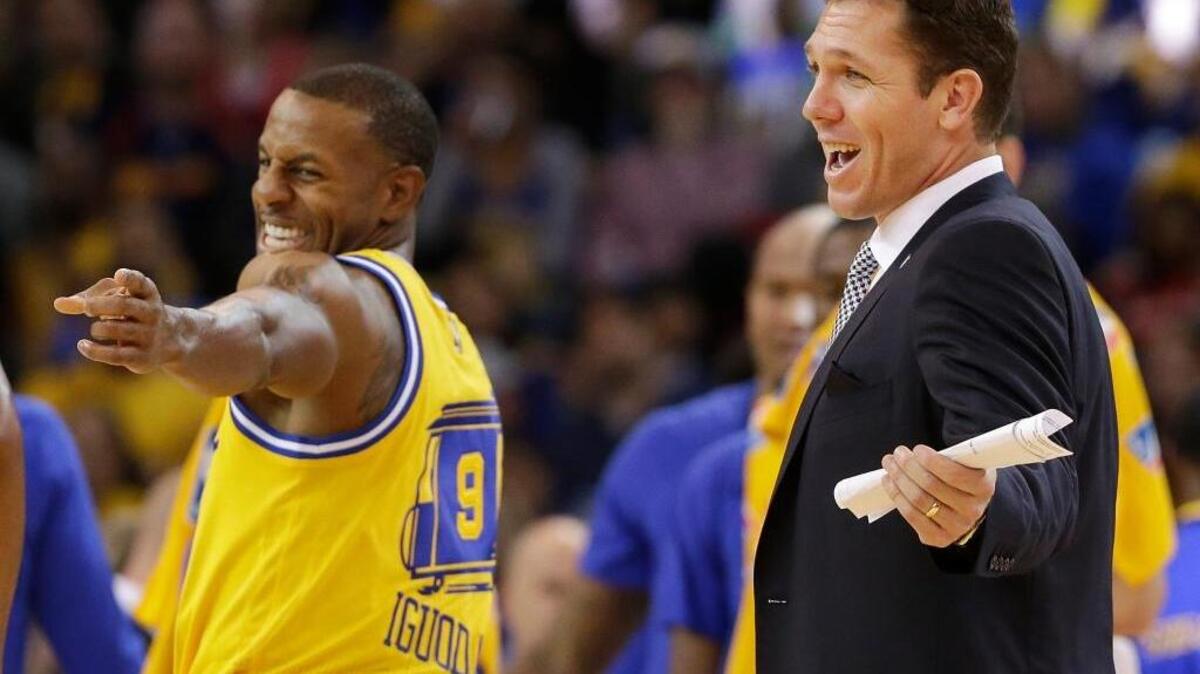 Interim coach Golden State Warriors coach Luke Walton, right, and forward Andre Iguodala react during an NBA basketball game against the Los Angeles Lakers in Oakland, Tuesday, Nov. 24, 2015. Walton was recognized as the NBA’s Western Conference Coach of the Month for November, but his wins as interim coach will be officially credited to Steve Kerr, who is recovering from back surgery.