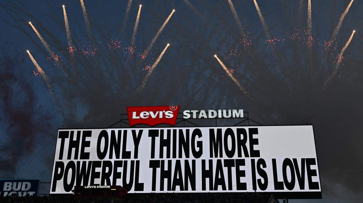 TOPSHOT - A message is displayed while Puerto Rican singer Bad Bunny performs during the Super Bowl LX Patriots vs Seahawks Apple Music Halftime Show at Levi's Stadium in Santa Clara, California on February 8, 2026. 