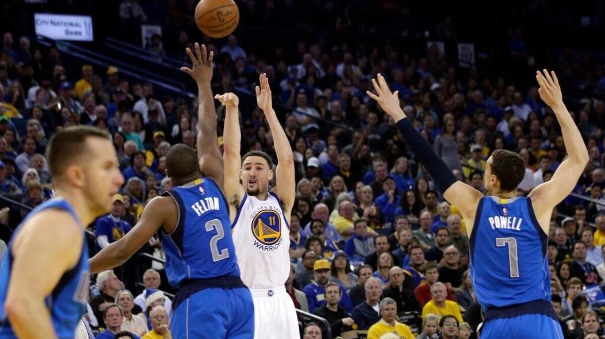 The Warriors’ Klay Thompson shoots against the Dallas Mavericks in the second half Friday, March 25, 2016, in Oakland.