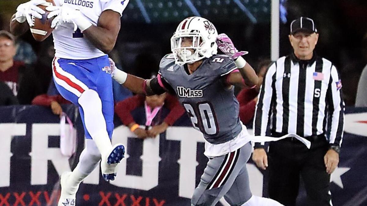 Louisiana Tech’s Carlos Henderson, left, catches a touchdown against Massachusetts’ Jordin Hamilton during the fourth quarter of an NCAA college football game Saturday, Oct. 15, 2016, in Foxborough, Mass. Henderson finished with 326 yards and five scores.