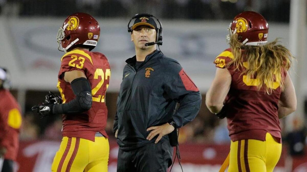 
USC coach Steve Sarkisian, center, looks on during his team’s 17-12 Pacific-12 Conference loss to Washington in an NCAA college football game, Thursday, Oct. 8, 2015, in Los Angeles. By the weekend, Sarkisian was placed on indefinite leave, and by Monday, he was fired.
