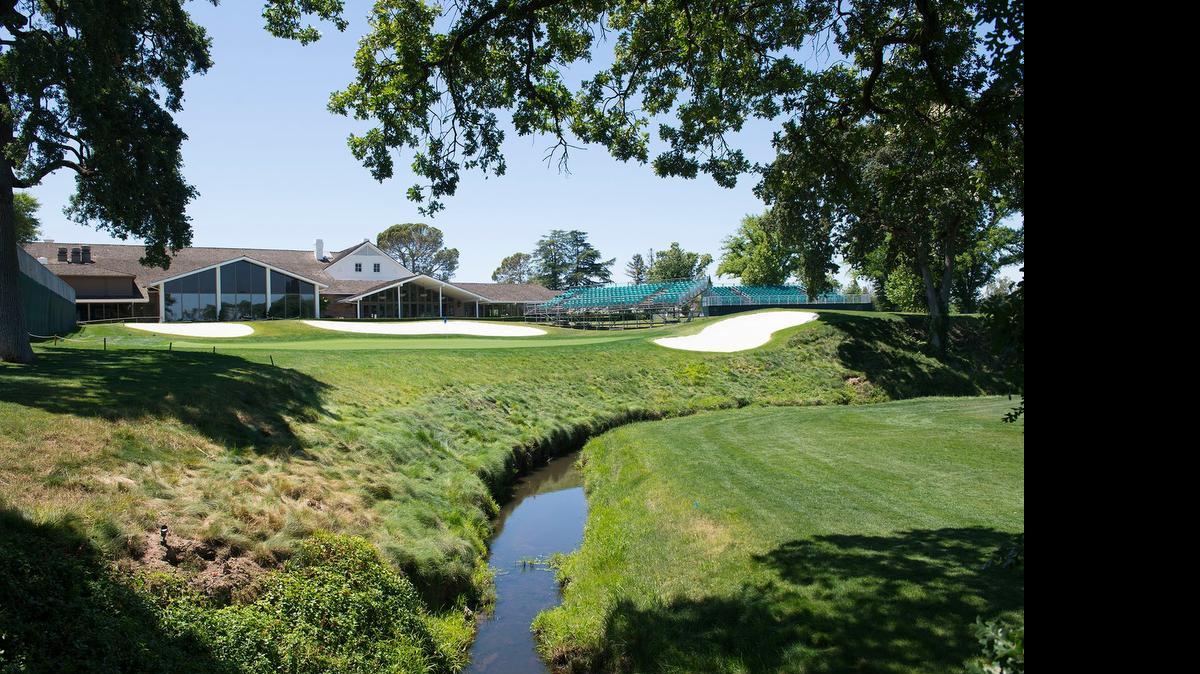 
Chicken Ranch Slough, center, slices past the 18th green, left, and comes into play on six holes of the Del Paso Country Club layout.


