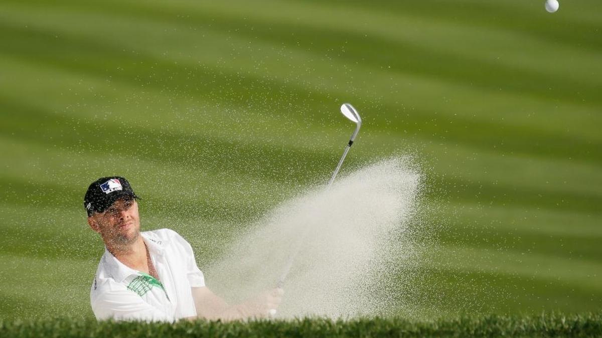 Spencer Levin hits out of a bunker onto the 18th green during the first round of the AT&T Pebble Beach National Pro-Am golf tournament in 2016.