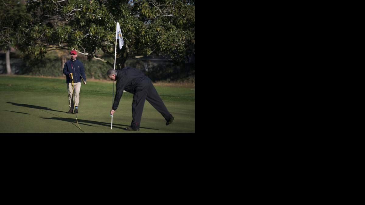 
USGA official Matt Sawicki, left, and Del Paso course superintendent Mark McKinney strategize hole locations at the Del Paso Country Club on Monday, Nov. 24, 2014, in Arden-Arcade, Calif.
